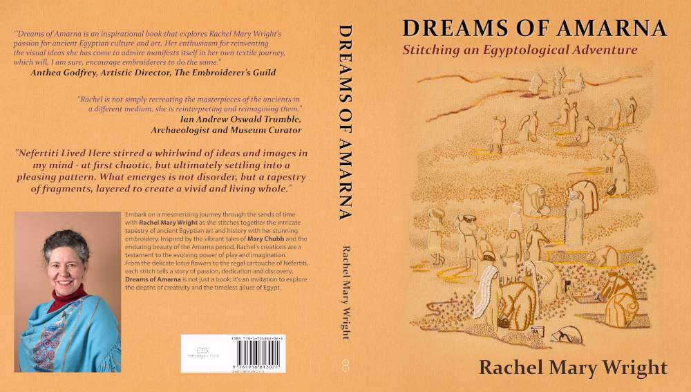 Back, spine, and front of the book "Dreams of Amarna - Stitching an Egyptological Adventure" by Rachel Mary Wright. The book is a sandy yellow, the picture on the front an embroidered picture of a dig in progress. The author photo on the back shows a white woman with dark hair, going grey at the temples. She's wrapped in a faience-blue pashmina and smiling at the camera.