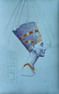Photograph of the embroidered Head of Nefertiti, which is on a turquoise fabric, screenprinted with a navy blue shaded representation of the famous bust. Elements of the design are highlighted using silk and gold threads.